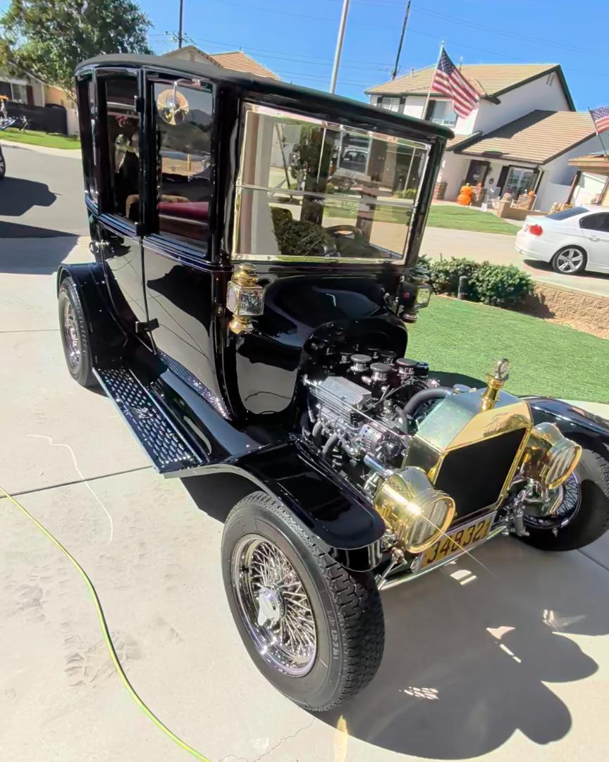 Black classic touring car after a detail